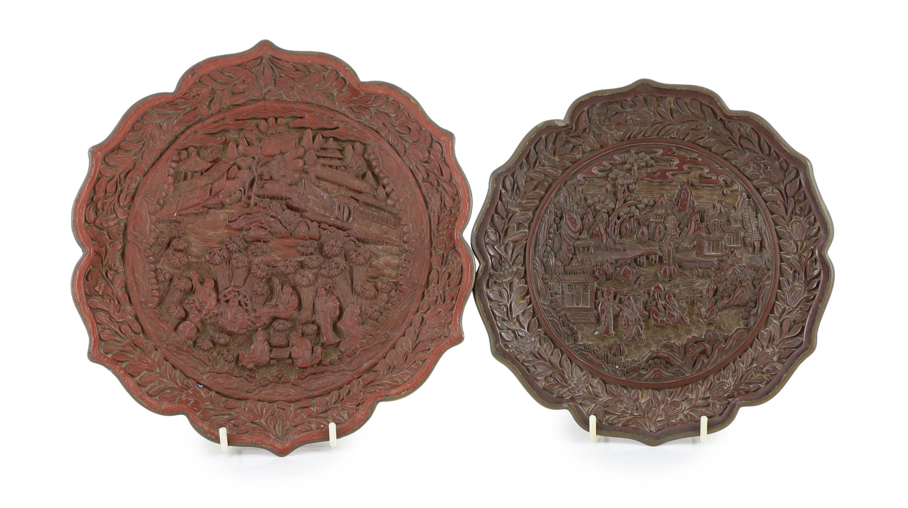 Two similar Chinese cinnabar lacquer dishes, Qianlong marks, late 19th century, 23.5cm & 20.5 cm diameter